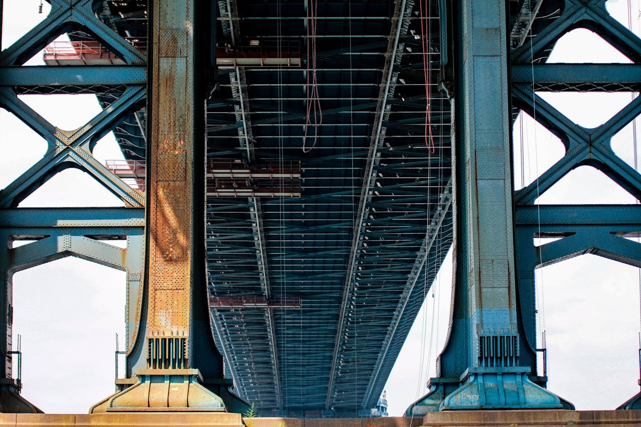 underside of a steel bridge captured from below to illustrate fatigue analysis context